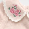 Baby-body met geborduurde kraag