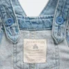 Baby-overall van denim met geborduurde bloemen
