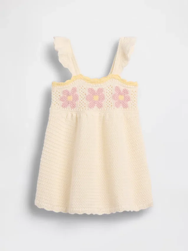 Babyjurk met gehaakte bloemen