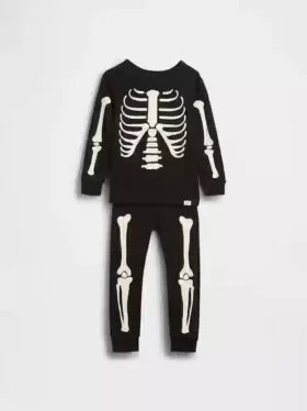 Biologische pyjamaset van geborsteld katoen voor kinderen en baby’s met in het donker oplichtend skeletmotief
