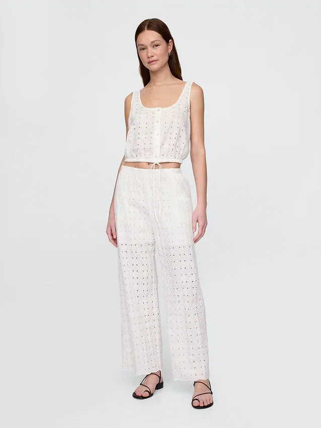 Broek met middelhoge taille, oogjes en wijde pijpen