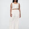 Broek met middelhoge taille, oogjes en wijde pijpen
