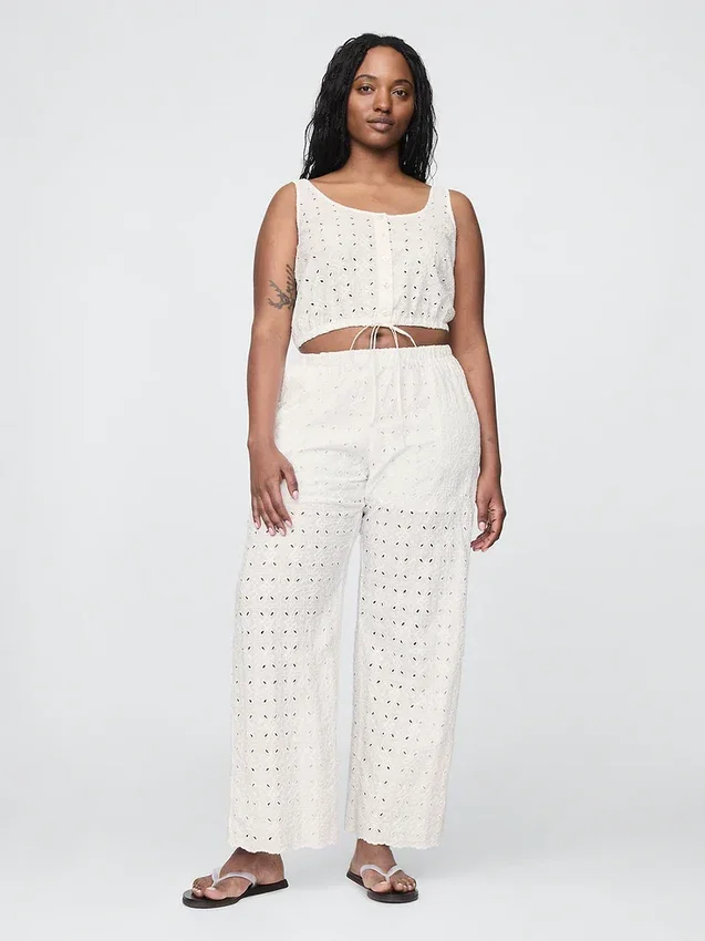 Broek met middelhoge taille, oogjes en wijde pijpen