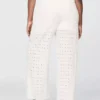 Broek met middelhoge taille, oogjes en wijde pijpen