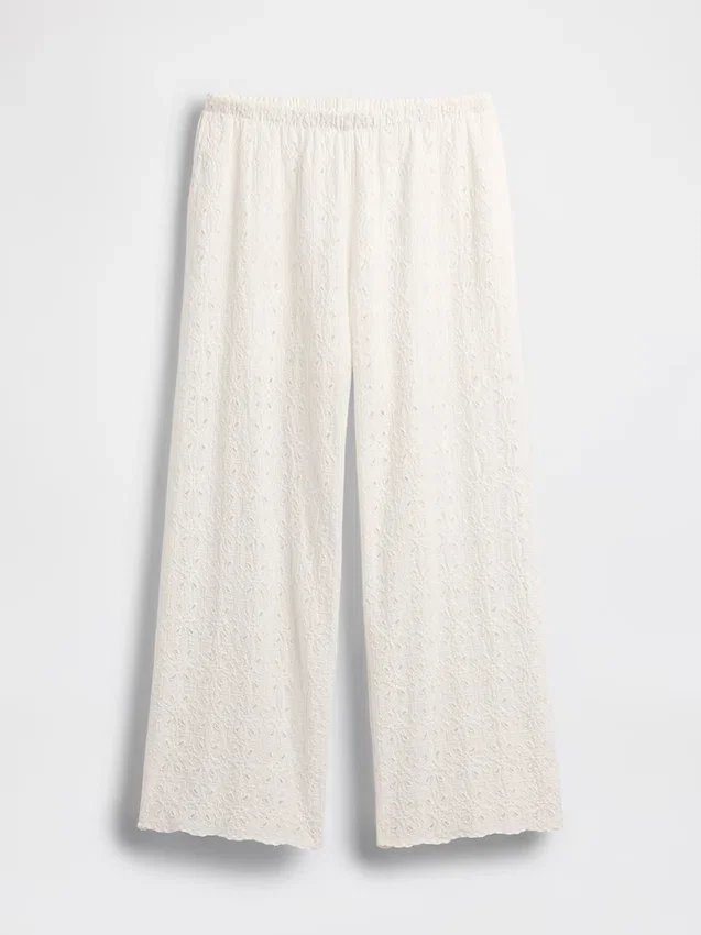 Broek met middelhoge taille, oogjes en wijde pijpen