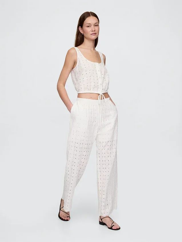 Broek met middelhoge taille, oogjes en wijde pijpen