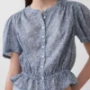 Crop-top met peplum en knoopsluiting aan de voorkant