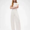 GAP × Victoria Beckham hooggetailleerde broek met plooien en gebogen zoom