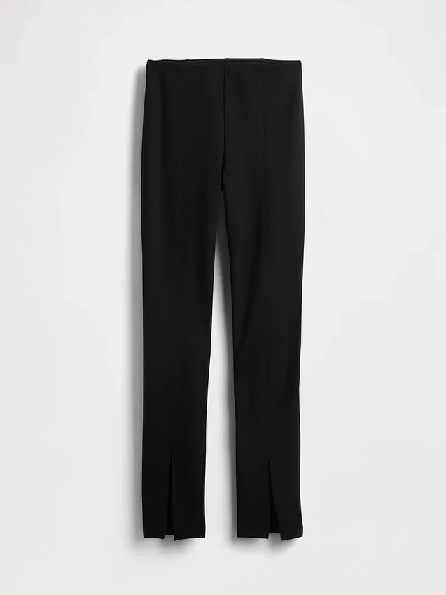 Hoge taille, dubbel gebreide broek met split in de zoom en uitlopende pijpen