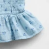 Kinder-top van katoenen gaas met smockwerk en peplum