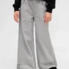 Kinderbaggy-Jeans met lage taille, strik en gespleten zoom