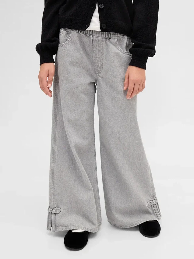 Kinderbaggy-Jeans met lage taille, strik en gespleten zoom
