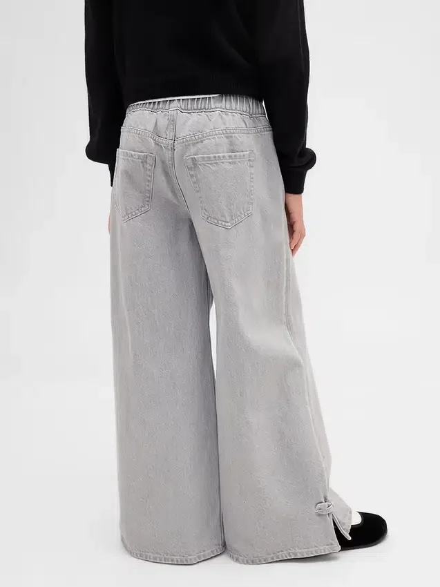 Kinderbaggy-Jeans met lage taille, strik en gespleten zoom
