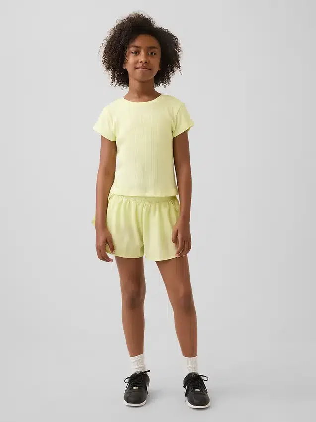 Kinderen: Sneldrogende korte broek met vlinderzoom