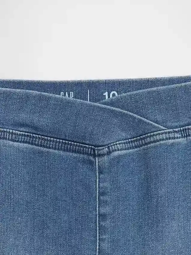 Kinderjeans met hoge taille en gekruiste banden