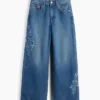 Kinderjeans met lage taille, brede pijpen en geborduurde bloemen