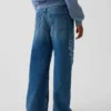 Kinderjeans met lage taille, brede pijpen en geborduurde bloemen