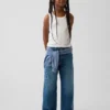 Kinderjeans met lage taille, brede pijpen en geborduurde bloemen