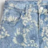 Kinderjeans met lage taille en bloemenprint
