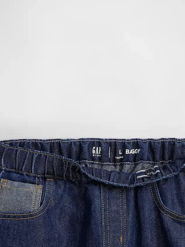 Kinderjeans met lage taille, losse pasvorm en metallic effect