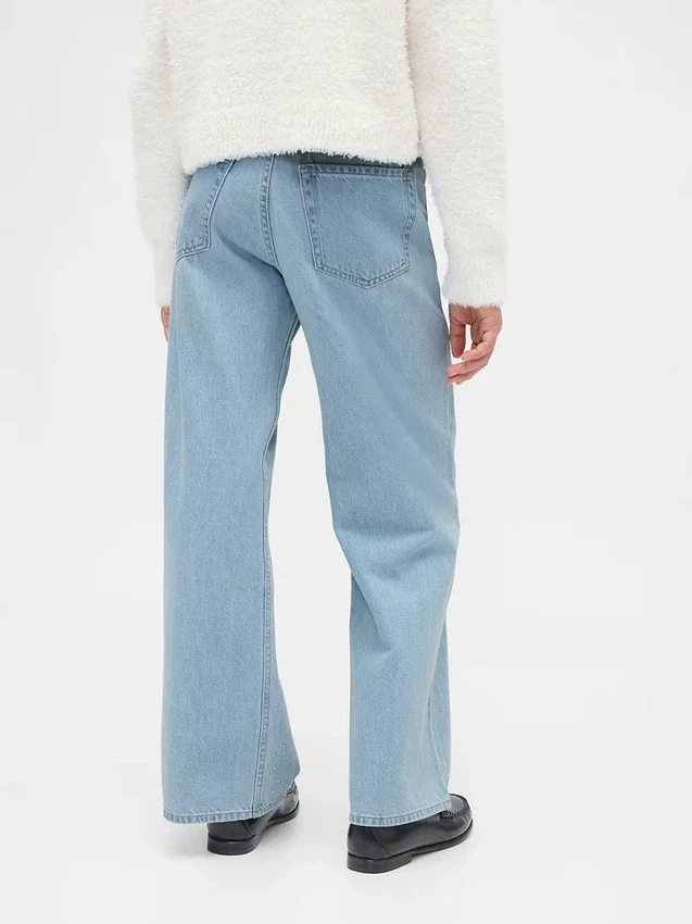 Kinderjeans met lage taille, strikjes en wijde pijpen