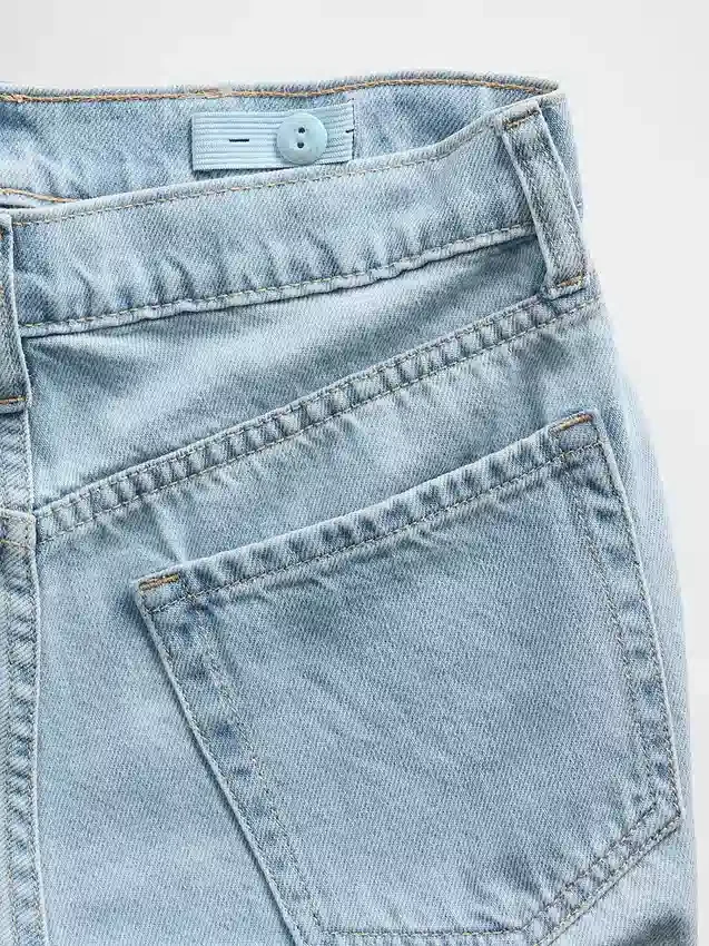 Kinderjeans met lage taille, strikjes en wijde pijpen