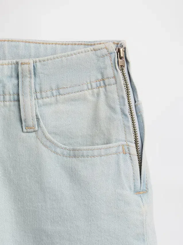 Kinderjeans met lage taille, vetersluiting en relaxte flare