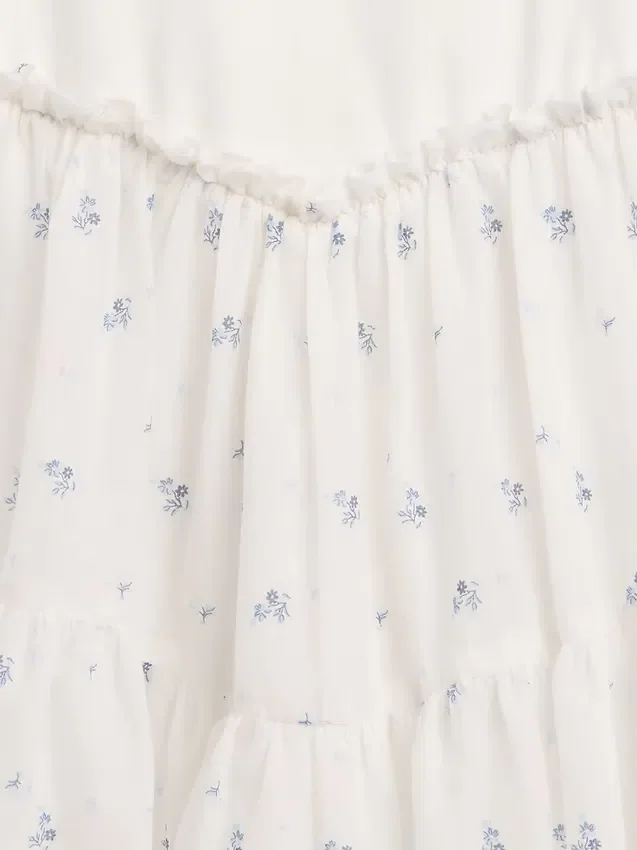 Kinderjurk van gemengde materialen met gelaagde tanktop