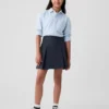 Kinderuniform: geplooide kaki skort