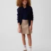 Kinderuniform: geplooide kaki skort