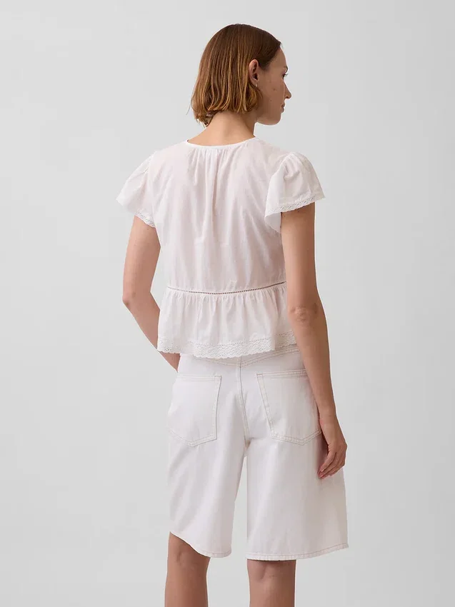 Korte peplumtop van kanten voile