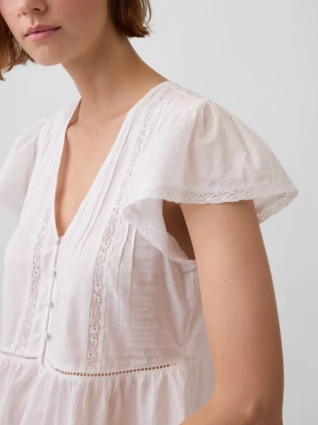 Korte peplumtop van kanten voile