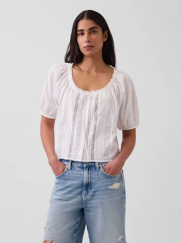 Korte top met plooitjes en ellebooglange mouwen
