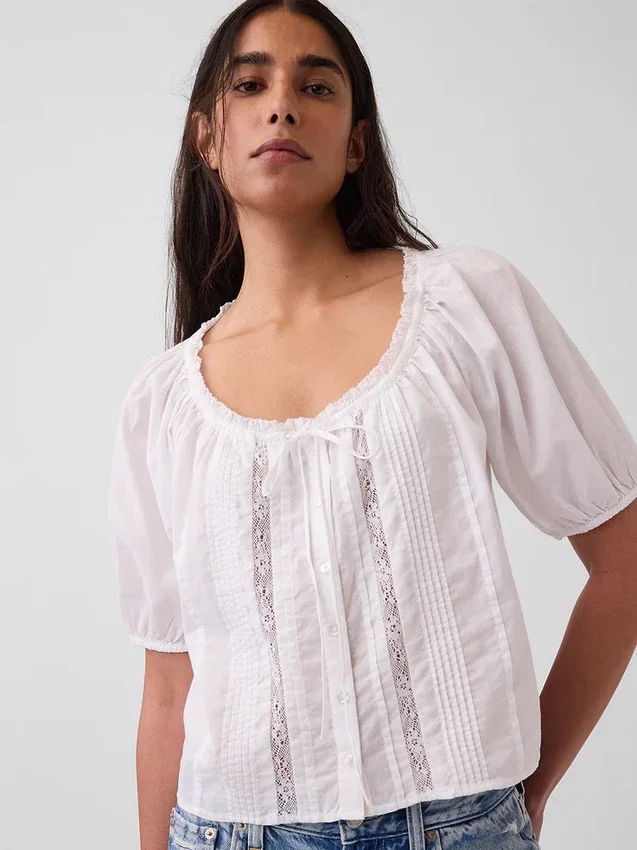 Korte top met plooitjes en ellebooglange mouwen