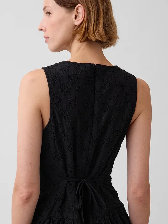 Maxijurk met oogjes en lage taille