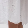 Maxijurk met oogjes en lage taille