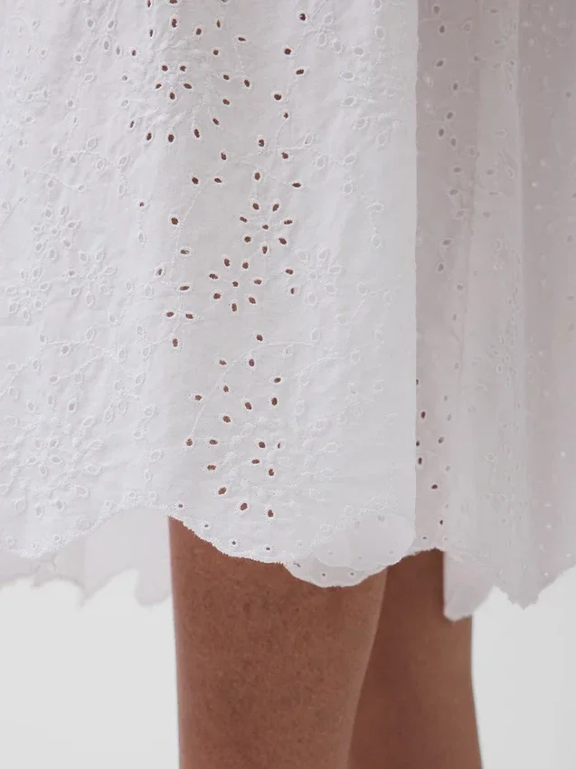 Maxijurk met oogjes en lage taille