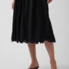 Maxijurk met oogjes en lage taille