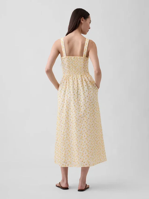 Maxijurk met oogjes, naden en lage taille