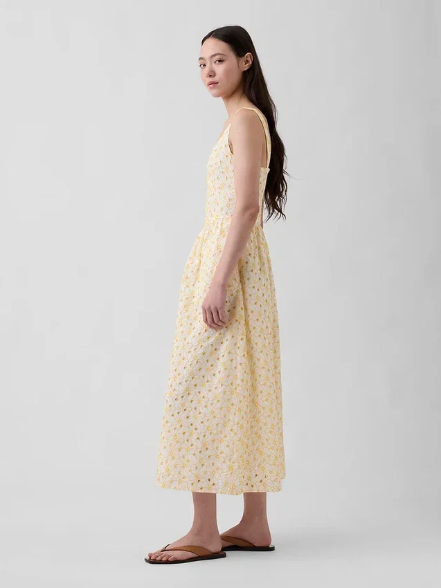 Maxijurk met oogjes, naden en lage taille