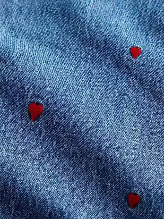 Mid-rise geborduurde, relaxte rechte Jeans