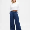 Mid-rise ultrazachte baggy Jeans met plooien