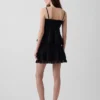Mini-skort met plooitjes en kanten rand