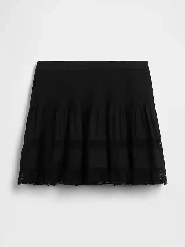 Mini-skort met plooitjes en kanten rand