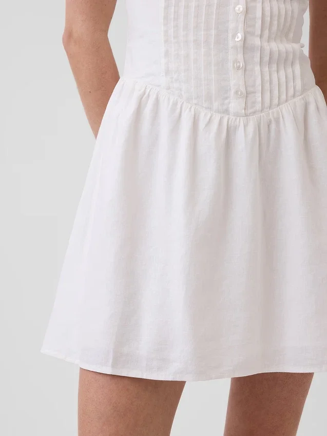 Minijurk met plooitjes en verlaagde taille