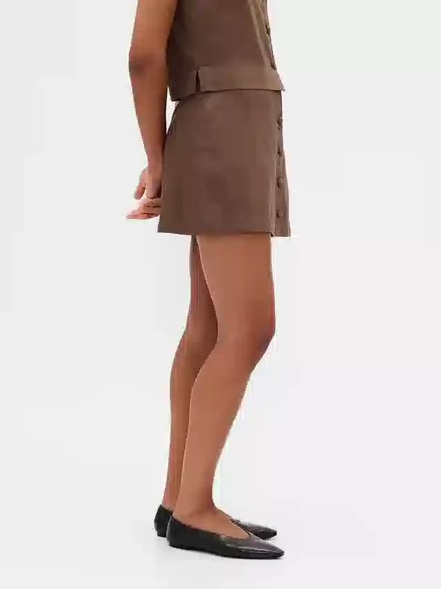 Miniskort van linnenmix met knoopsluiting aan de voorkant