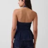 Nauwsluitende denim haltertop met peplum