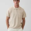 Oversized polo-trui met kwartrits en zak
