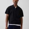 Oversized polo-trui met kwartrits en zak