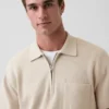 Oversized polo-trui met kwartrits en zak